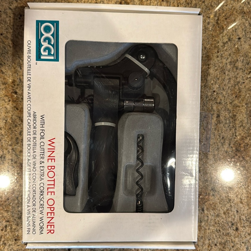 Oggi wine bottle opener. Brand new in box. Never opened.